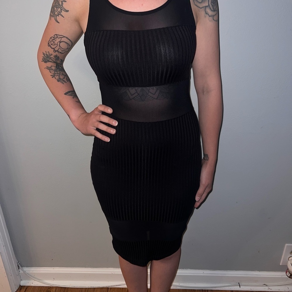 Bebe, beautiful great condition, black dress, sheer, sweater material